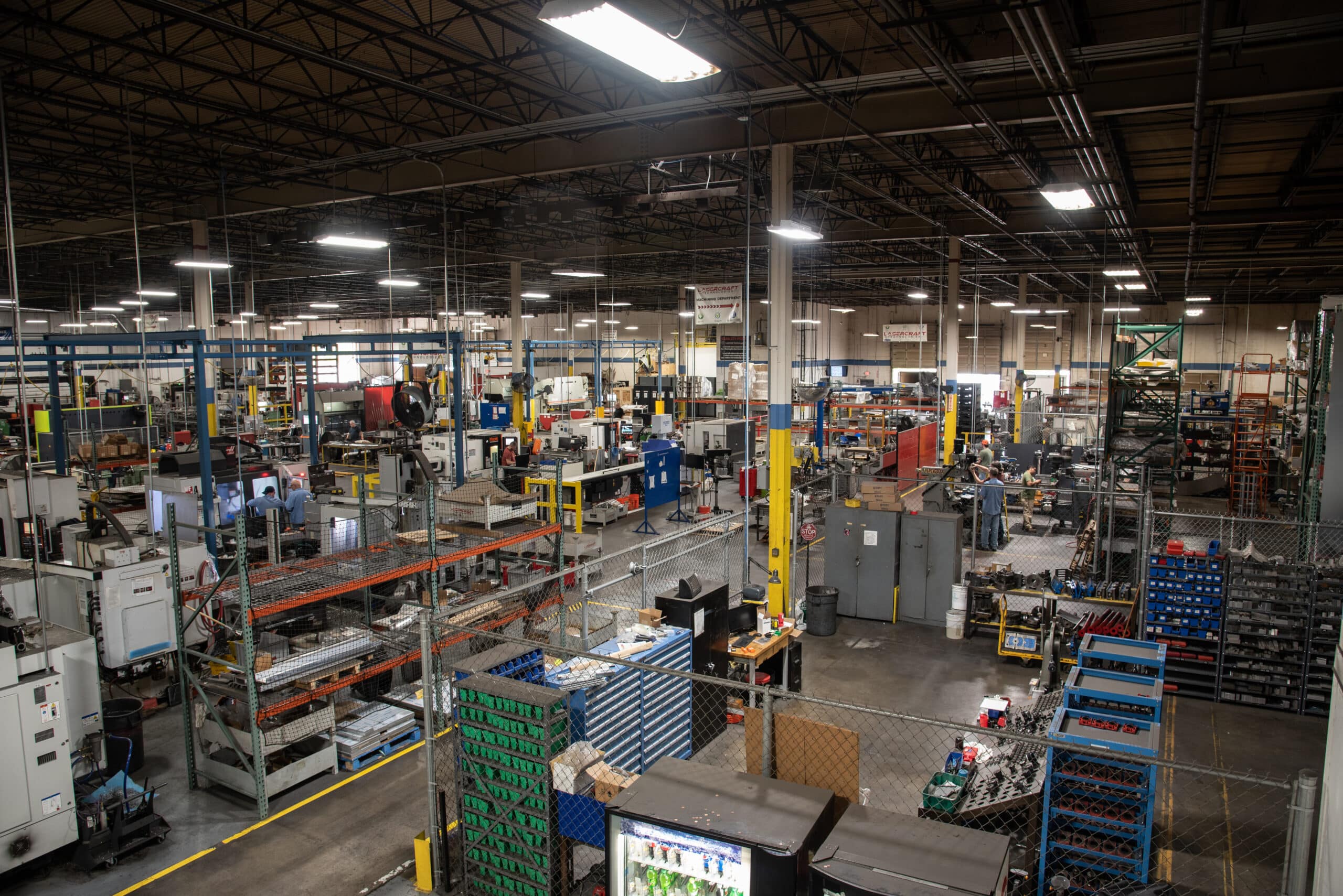 Laser Craft Tech warehouse wide shot with shelves and equipment